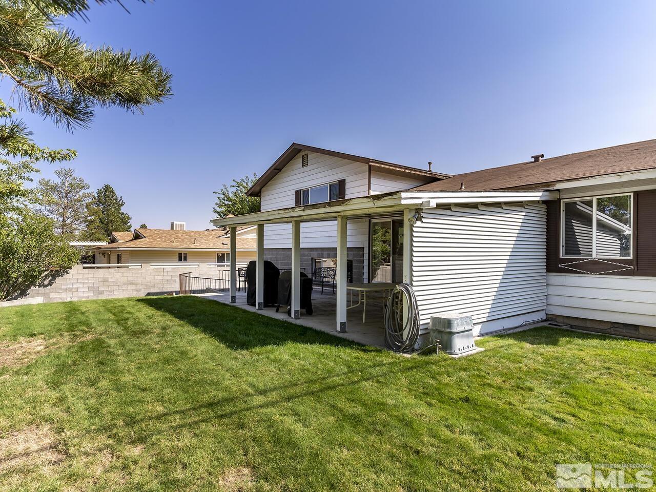 2785 Edgewood Drive Reno, NV 89503 - Photo 24 of 26 a view of a house with backyard porch and garden