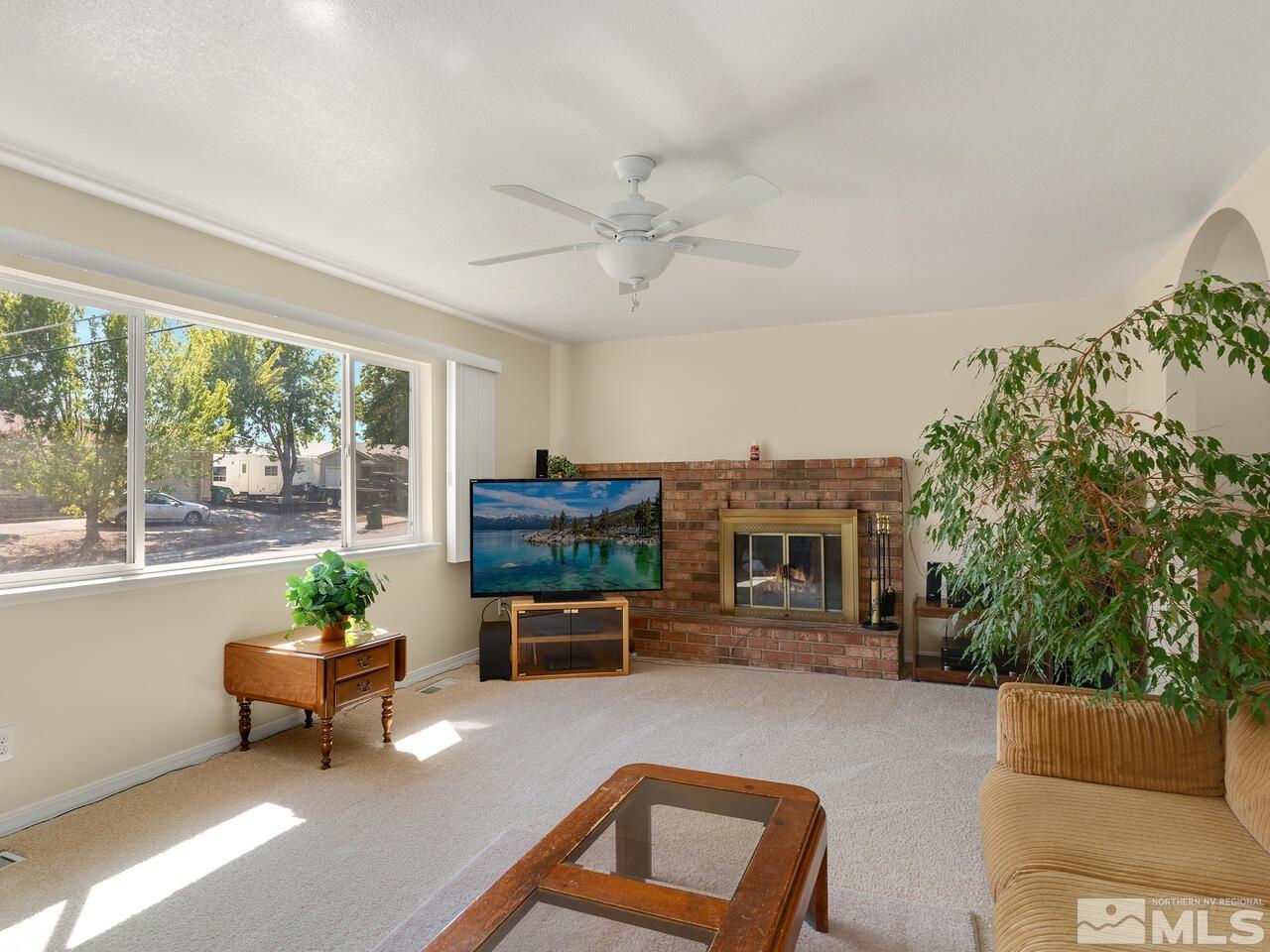 2785 Edgewood Drive Reno, NV 89503 - Photo 4 of 26 a living room with furniture and a fireplace