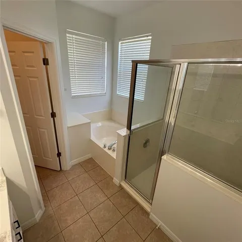 a bathroom with a double vanity sink and mirror