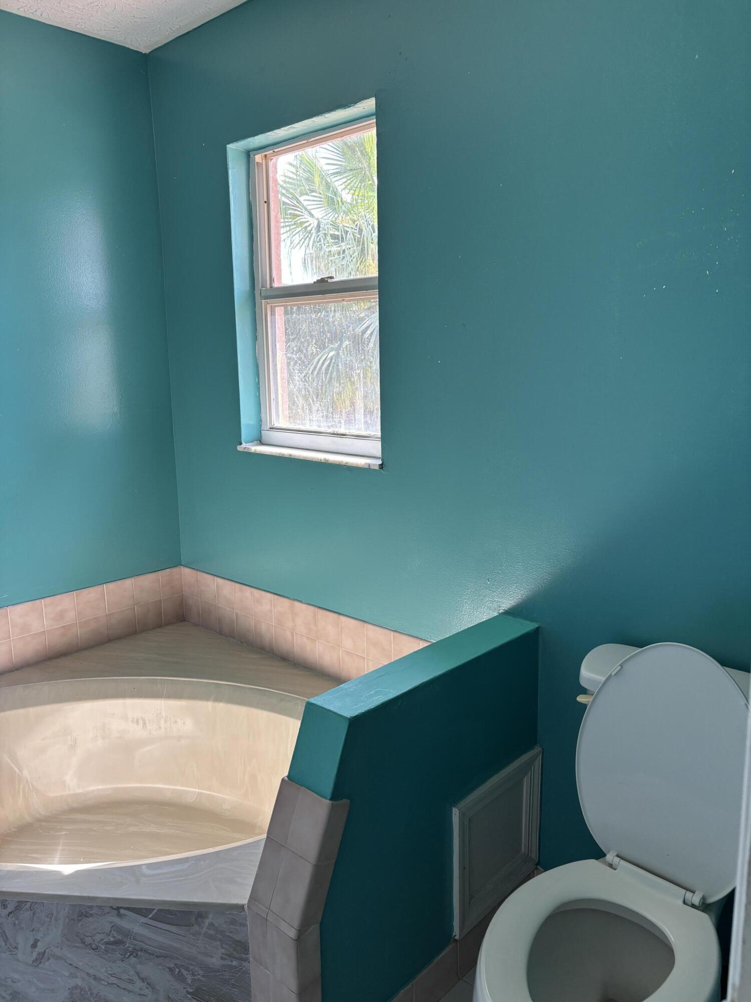 3710 Promenade Way Fort Pierce, FL 34982 - Photo 25 of 26 a bathroom with a toilet and a sink