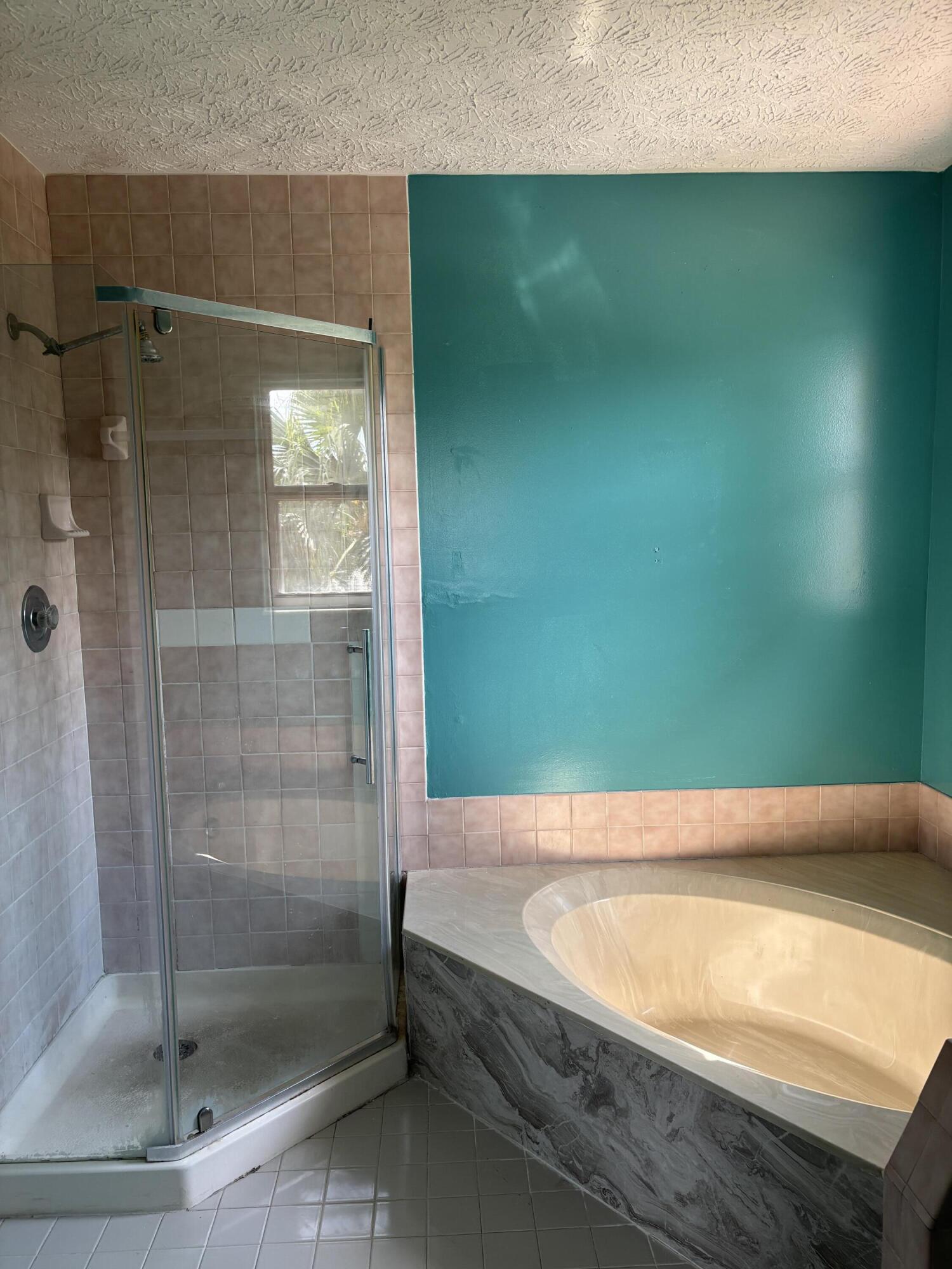 3710 Promenade Way Fort Pierce, FL 34982 - Photo 26 of 26 a bathroom with a bathtub and shower