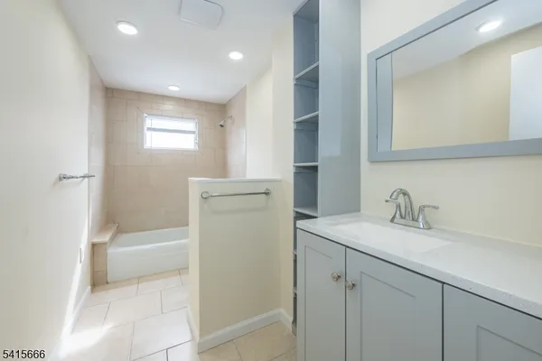 a bathroom with a sink a toilet and tub