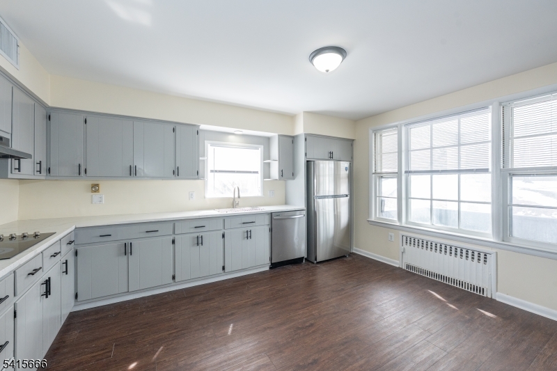 71 Washington Street Morristown, NJ 07960 - Photo 4 of 13 a kitchen with cabinets wooden floor and a window