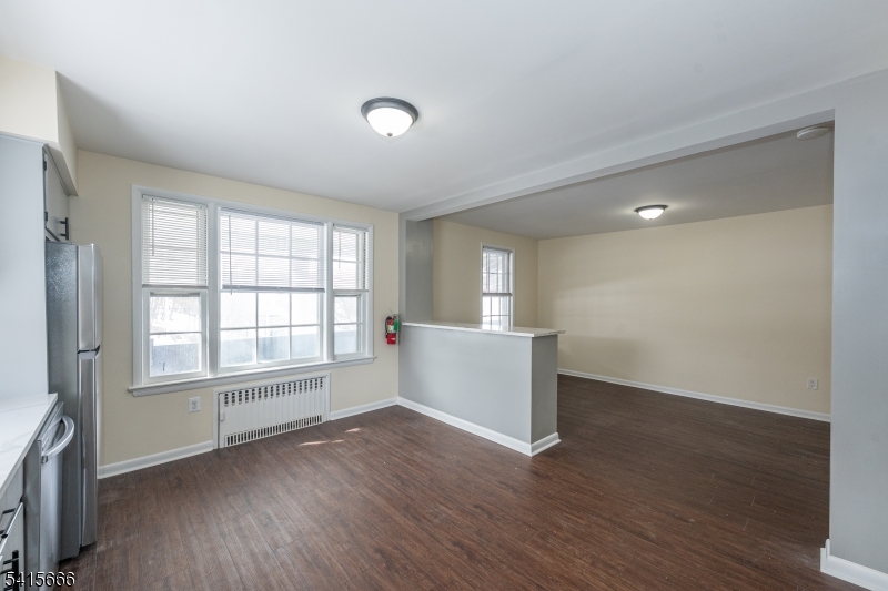 71 Washington Street Morristown, NJ 07960 - Photo 5 of 13 an empty room with wooden floor and windows