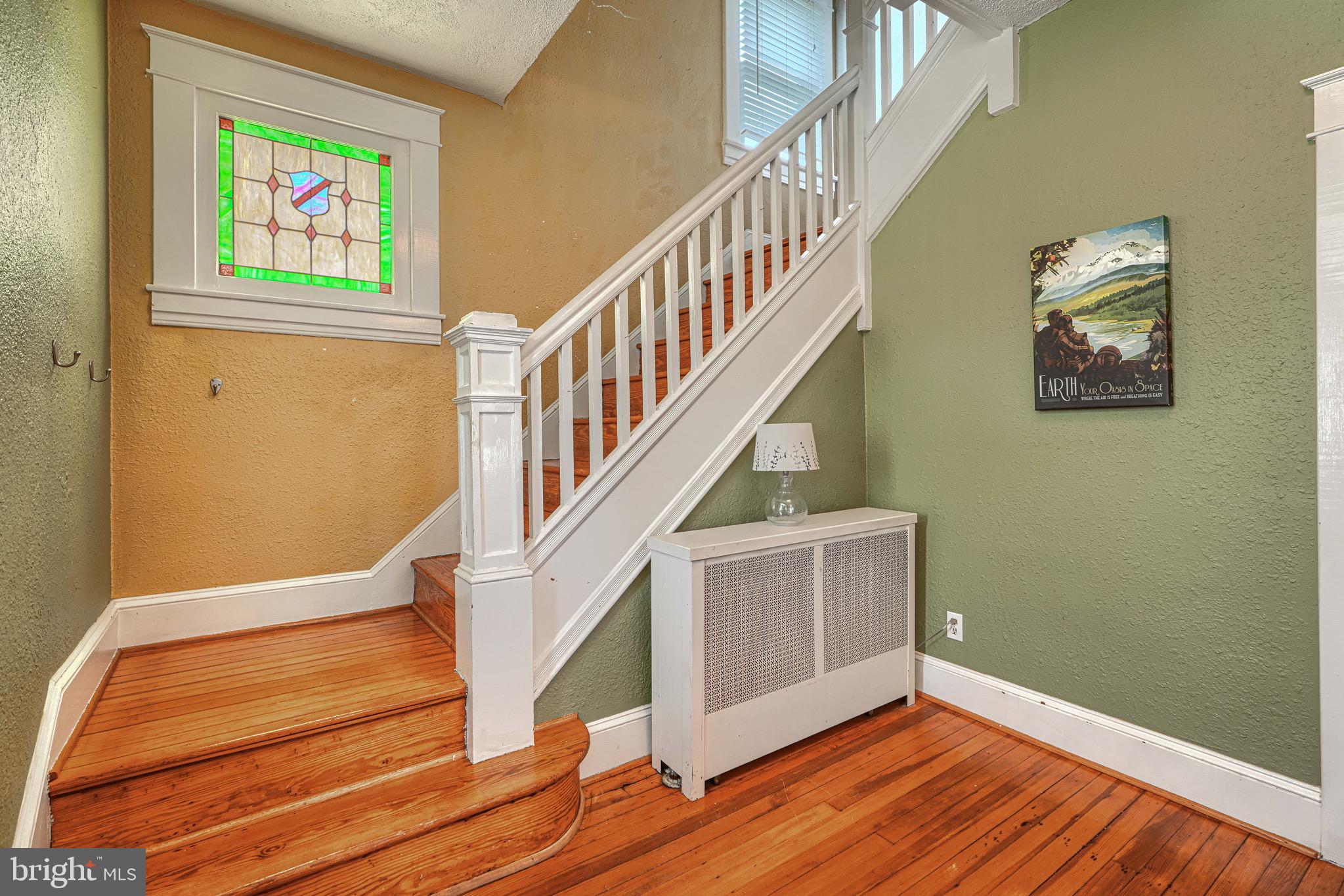 2705 Latona Road Baltimore, MD 21214 - Photo 6 of 53 a view of entryway and hall with wooden floor