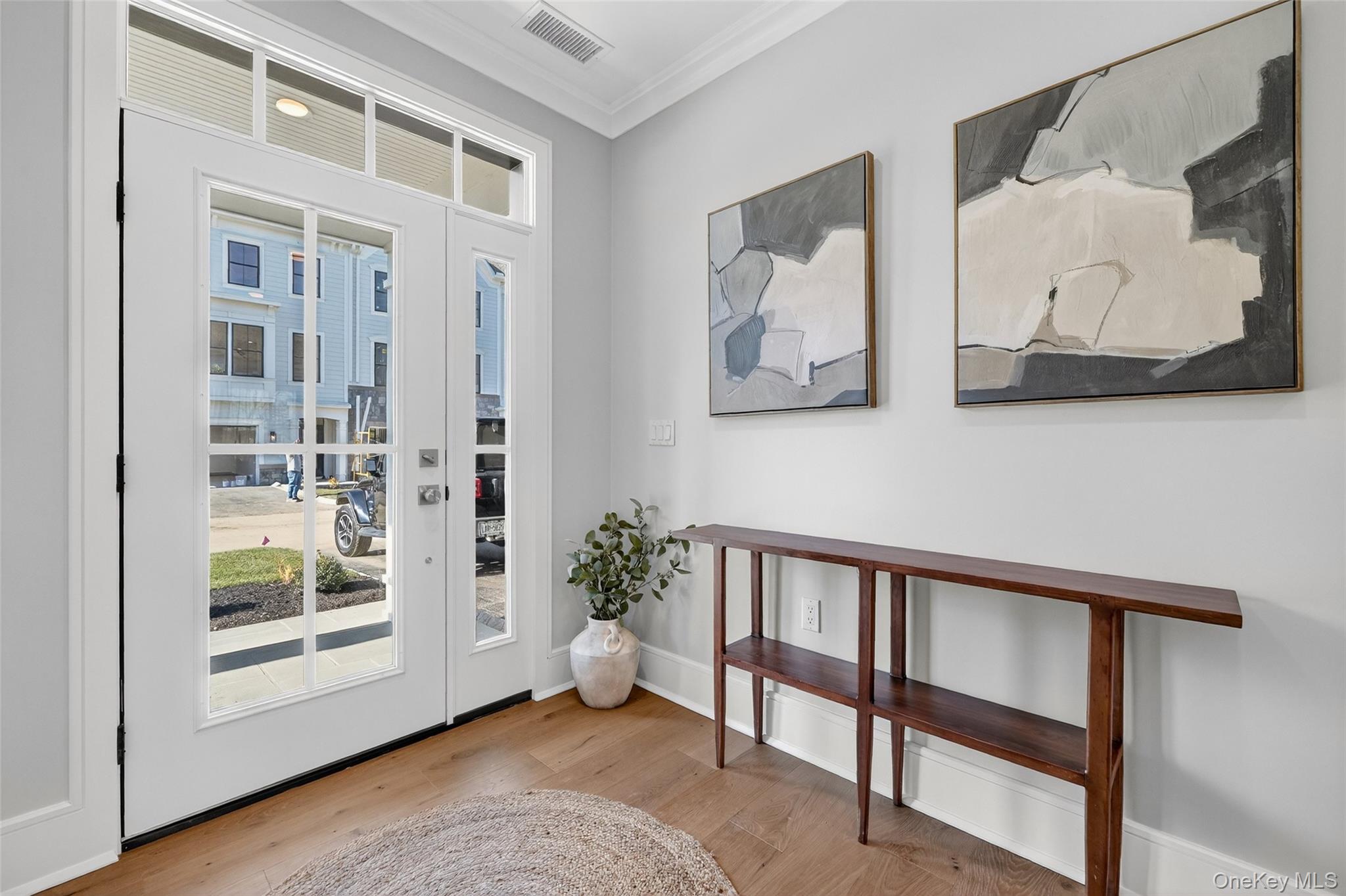 1808 Soundview Court Yorktown Heights, NY 10598 - Photo 2 of 39 a view of a hallway with paintings on the wall