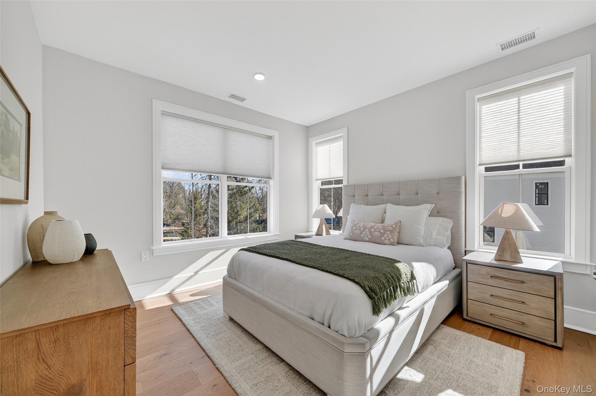 1808 Soundview Court Yorktown Heights, NY 10598 - Photo 26 of 39 a bedroom with a bed and wooden floor