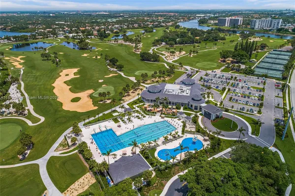 an aerial view of residential house with outdoor space and lake view