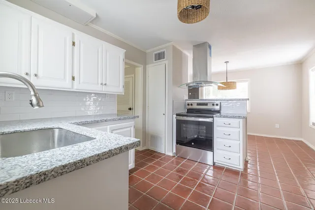 a bathroom with a granite countertop sink a toilet a mirror and shower