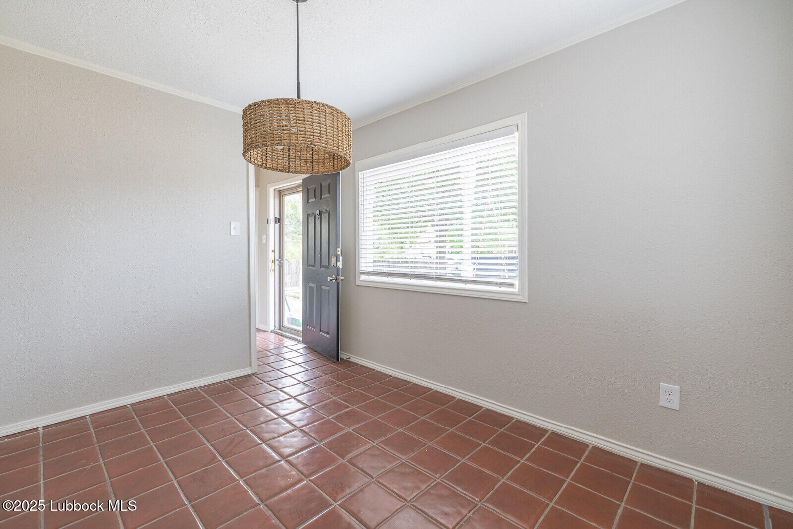 2614 24th Street Lubbock, TX 79410 - Photo 14 of 46 a view of an empty room with windows