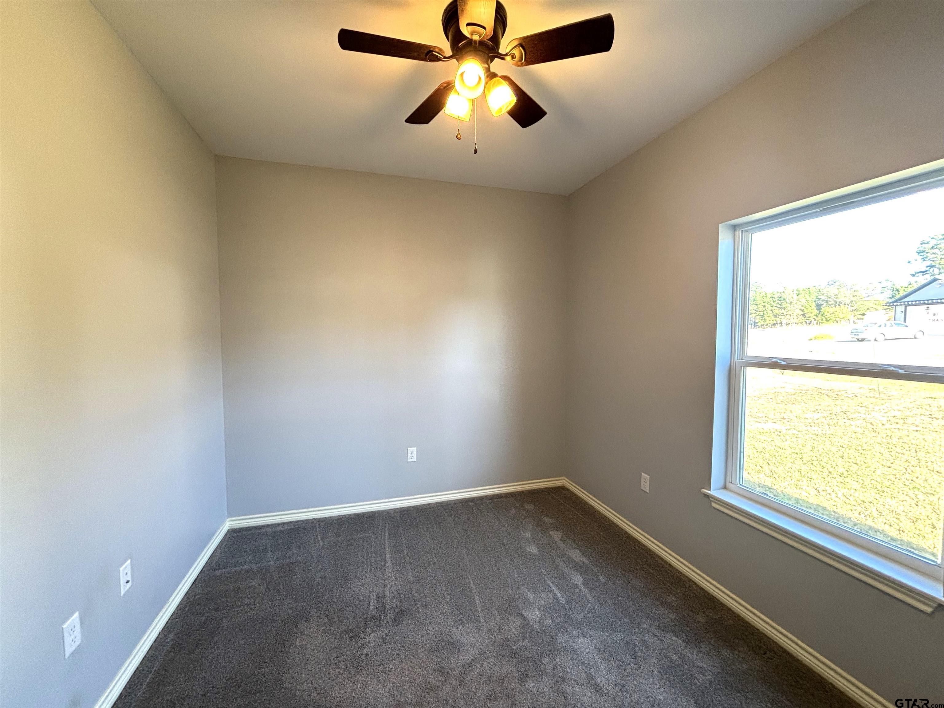 196 Twisted Oaks Road Rusk, TX 75785 - Photo 16 of 25 an empty room with a window
