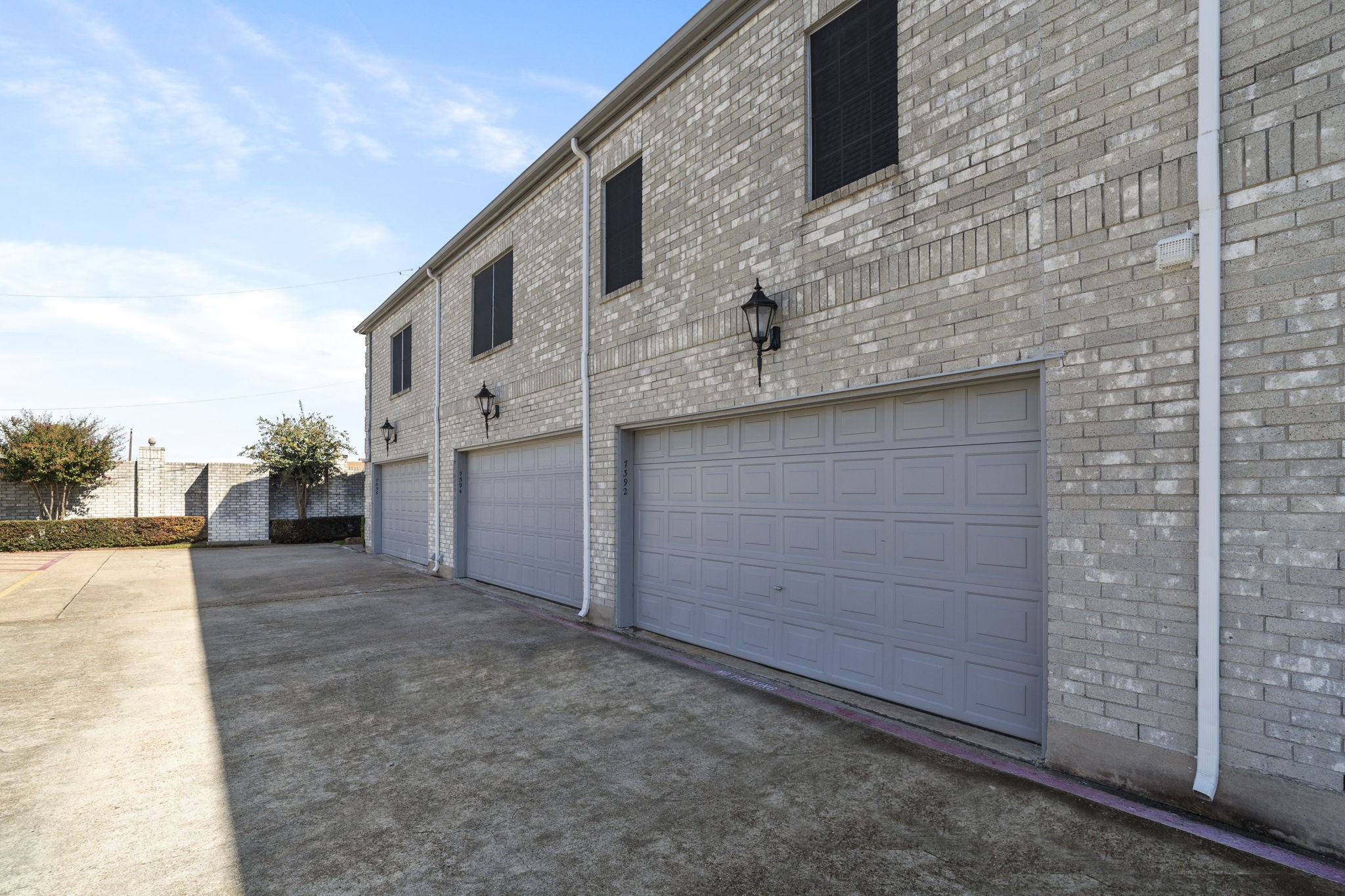 7392 Regency Square Court, Unit 7392 Houston, TX 77036 - Photo 28 of 32 Enjoy the convenience of an attached two-car garage, privately accessed through a rear alley.