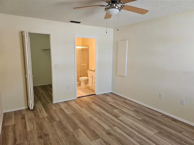 a view of an empty room and a window