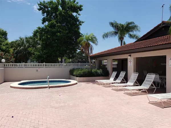 a house with palm tree in front of it