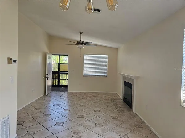 a view of an empty room with a window