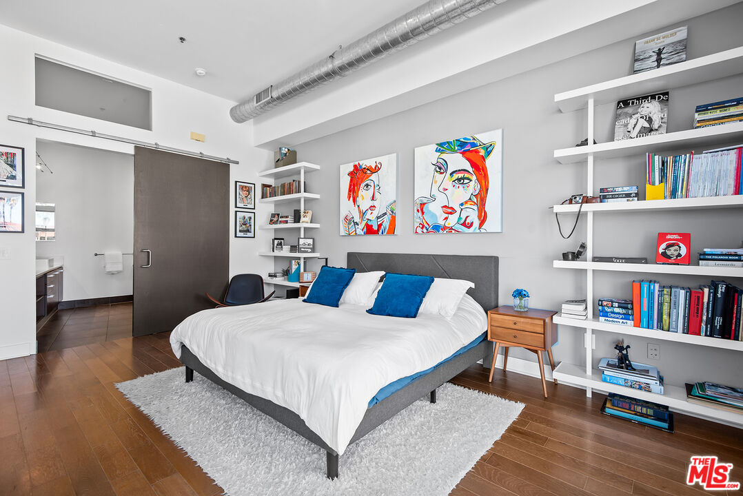 13320 Beach Avenue, Unit 304 Marina del Rey, CA 90292 - Photo 12 of 25 a bedroom with a bed and a book shelf