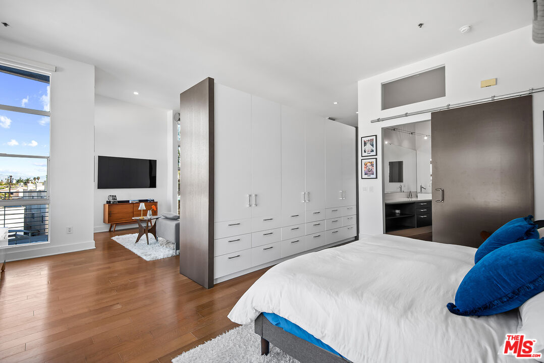 13320 Beach Avenue, Unit 304 Marina del Rey, CA 90292 - Photo 13 of 25 a bedroom with a bed and a flat screen tv