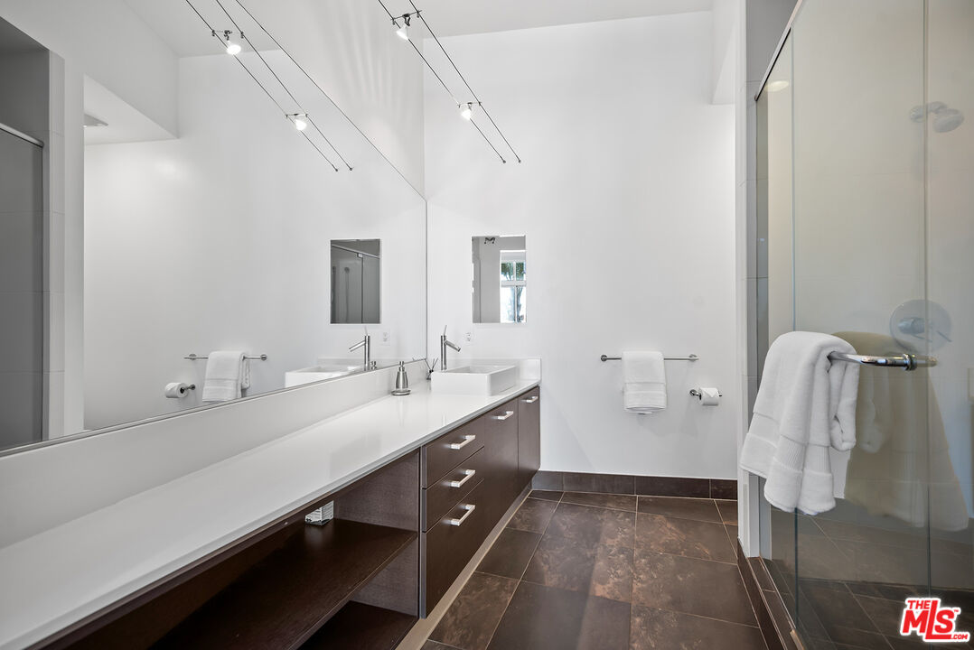 13320 Beach Avenue, Unit 304 Marina del Rey, CA 90292 - Photo 15 of 25 a bathroom with a double vanity sink and mirror