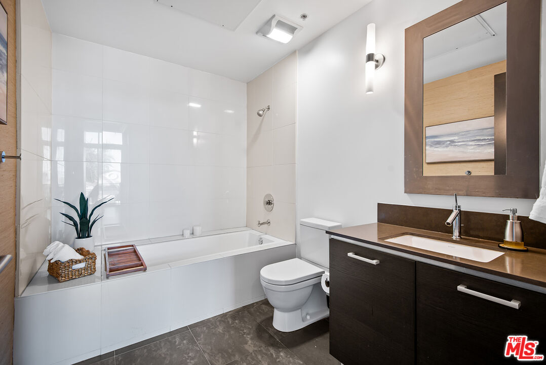 13320 Beach Avenue, Unit 304 Marina del Rey, CA 90292 - Photo 17 of 25 a bathroom with a sink a toilet and a bathtub