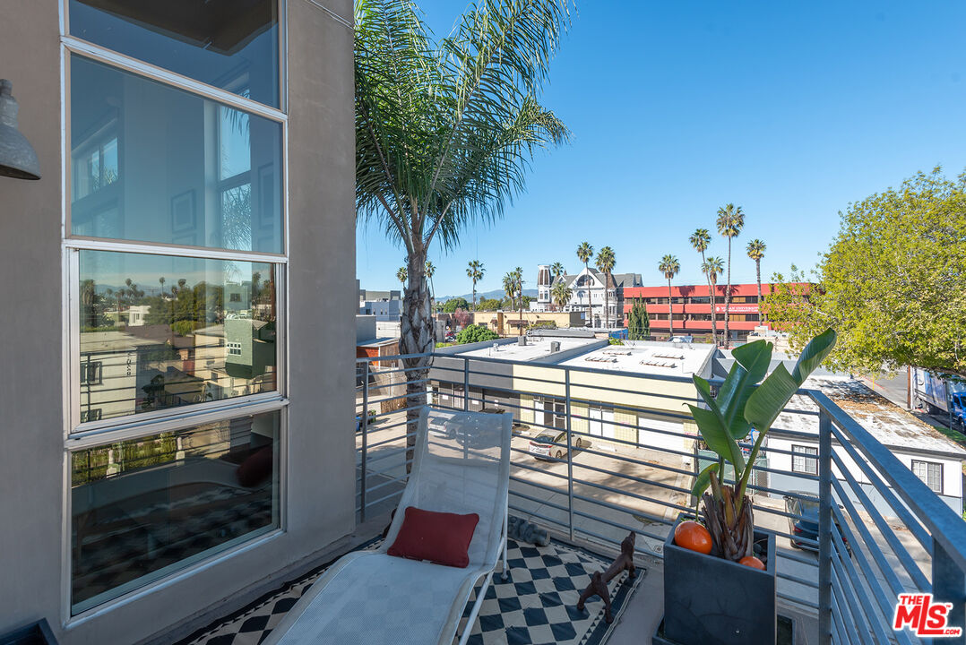 13320 Beach Avenue, Unit 304 Marina del Rey, CA 90292 - Photo 19 of 25 a balcony with table and chairs