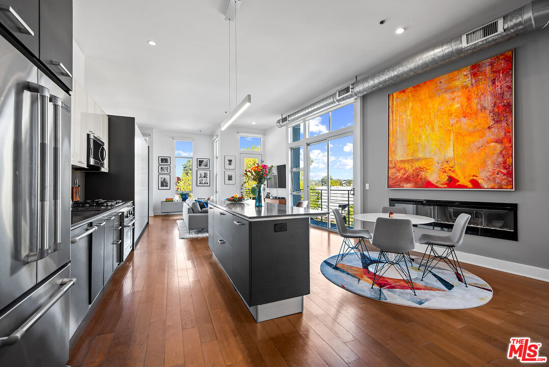 13320 Beach Avenue, Unit 304 Marina del Rey, CA 90292 - Photo 4 of 25 a living room with furniture flat screen tv and wooden floor