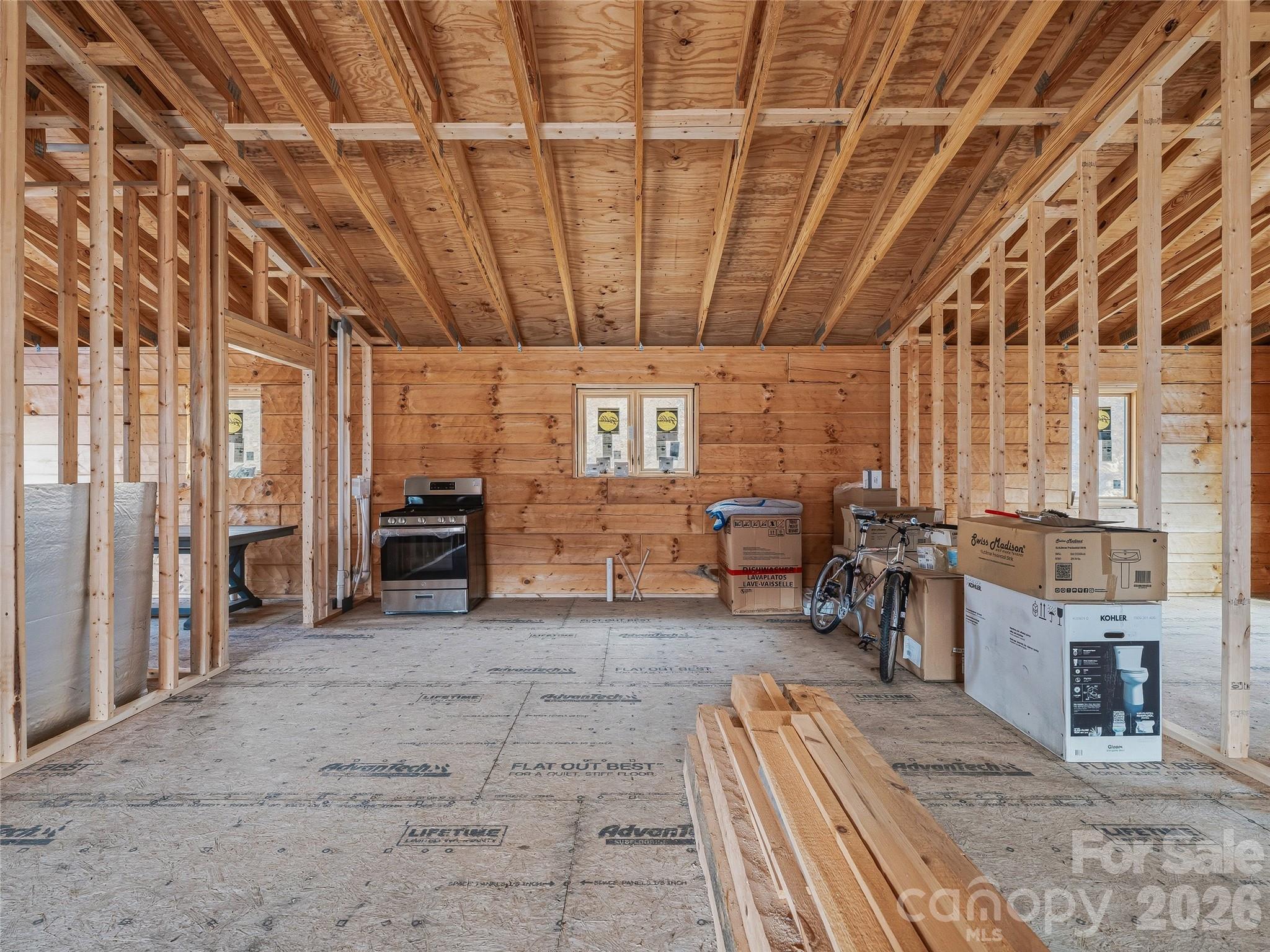 182 Whittemore Branch Road Barnardsville, NC 28709 - Photo 23 of 46 a view of a livingroom with furniture a ceiling fan and window