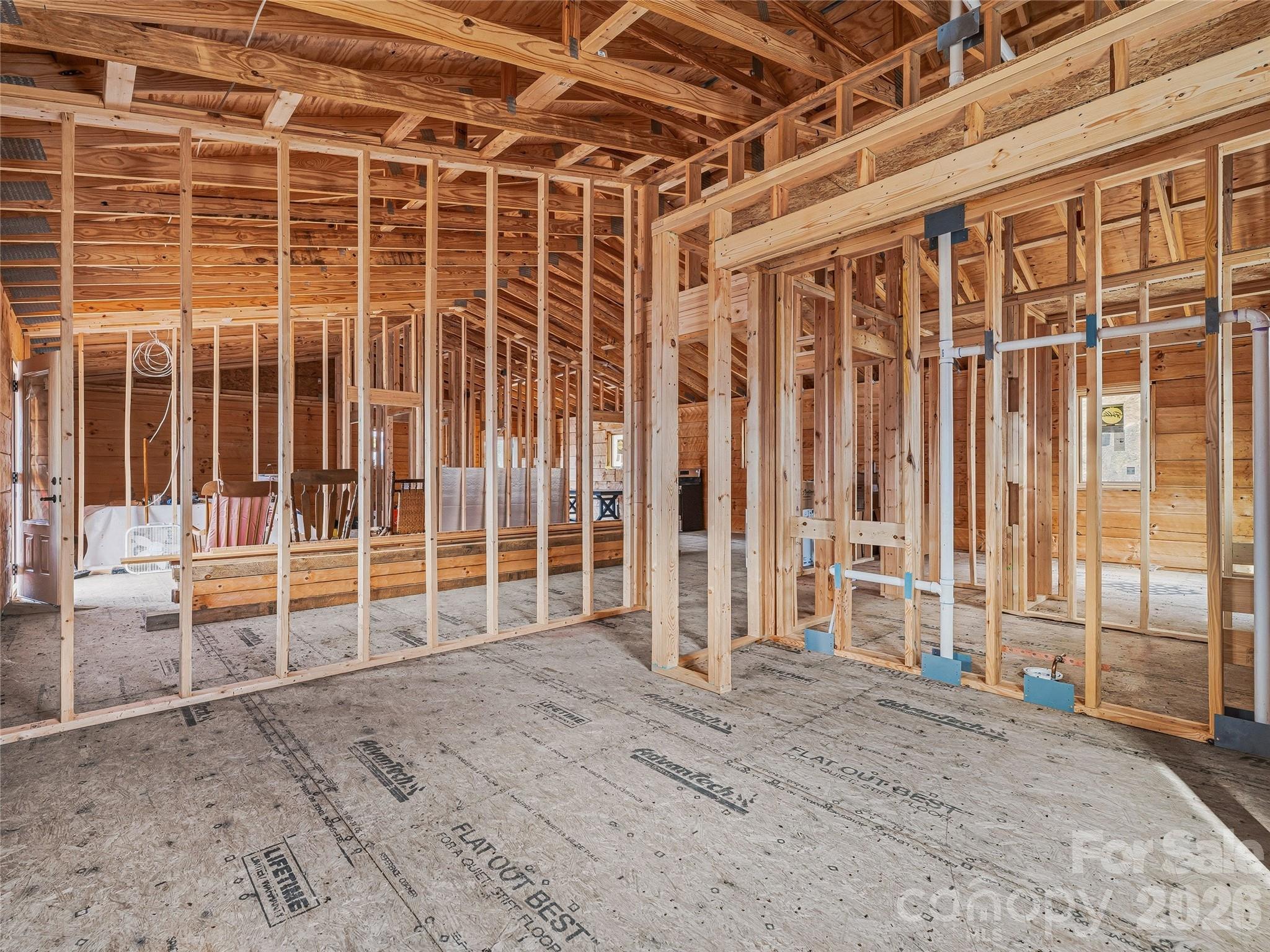 182 Whittemore Branch Road Barnardsville, NC 28709 - Photo 26 of 46 a view of an empty room with wooden frame