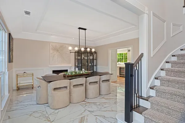 a kitchen with a stove a sink and a wooden floor
