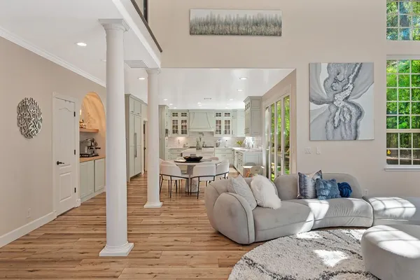 a dining room with furniture and wooden floor