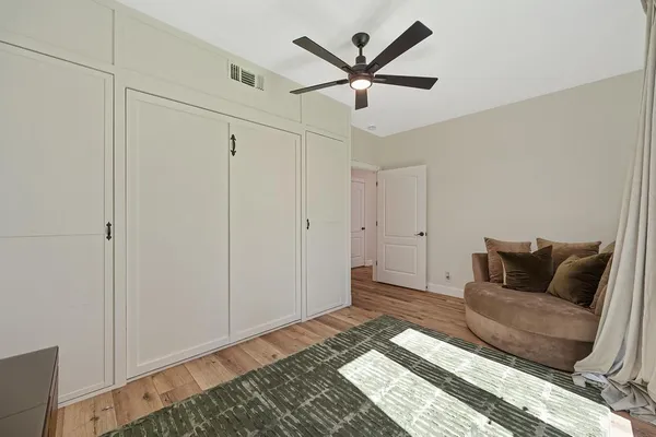 a spacious bathroom with a double vanity sink a mirror a bathtub and shower