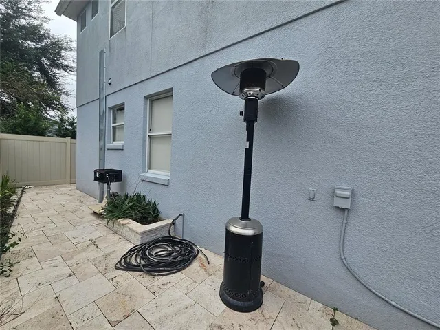 a view of a terrace with a sink and cabinets