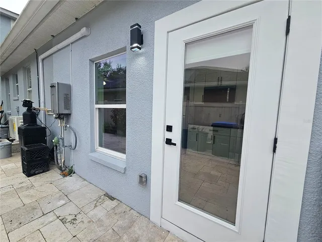 a bathroom with a glass shower door and a mirror