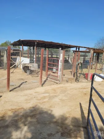 a view of a patio with swimming pool table and chairs