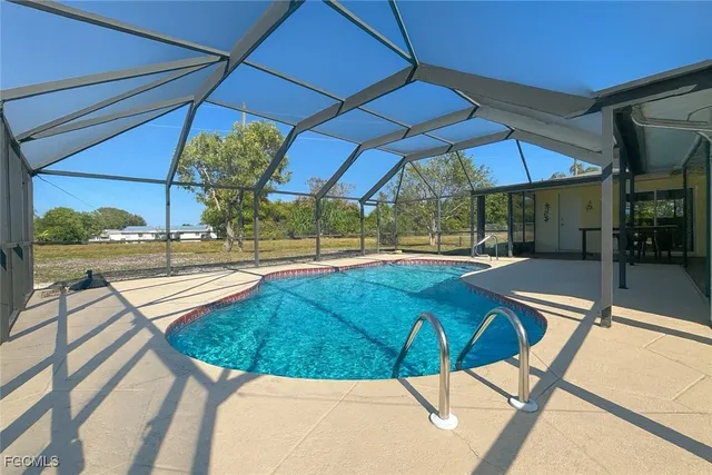 a view of a swimming pool with a patio