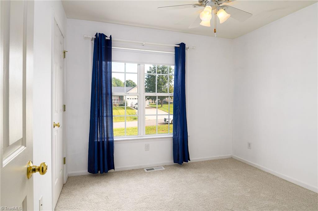 135 Winding Creek Road Mocksville, NC 27028 - Photo 16 of 32 2nd bedroom with new carpet and paint