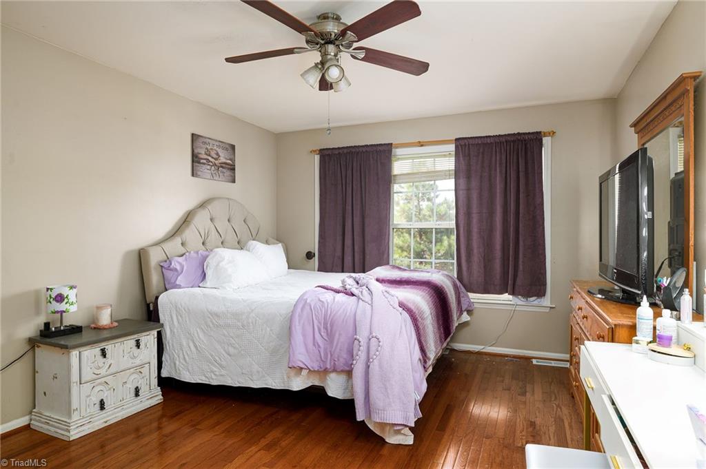135 Winding Creek Road Mocksville, NC 27028 - Photo 10 of 32 Huge primary bedroom with hardwood floors!