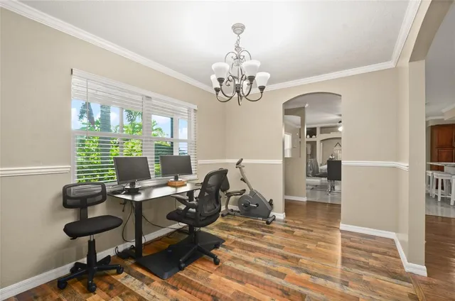 a view of a workspace with wooden floor