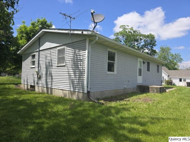 219 South 1st Street Carthage, IL 62321 - Photo 22 of 28 a view of a house with a yard