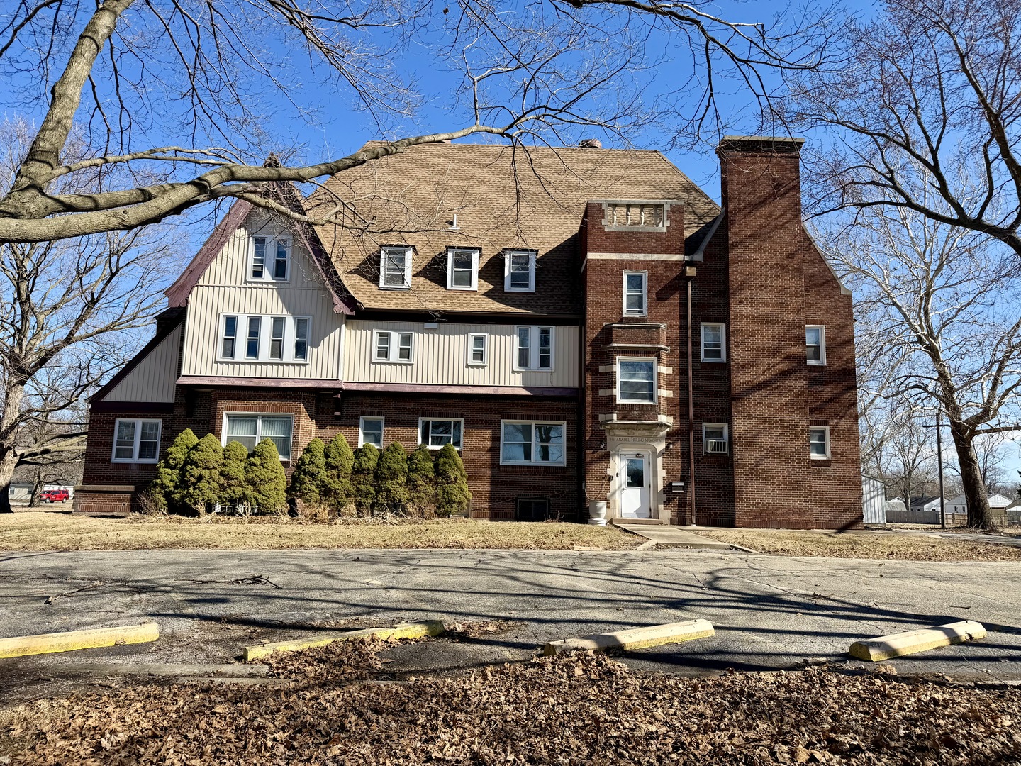 106 North Chanute Street Rantoul, IL 61866 - Photo 1 of 6 a front view of a residential apartment building with a yard