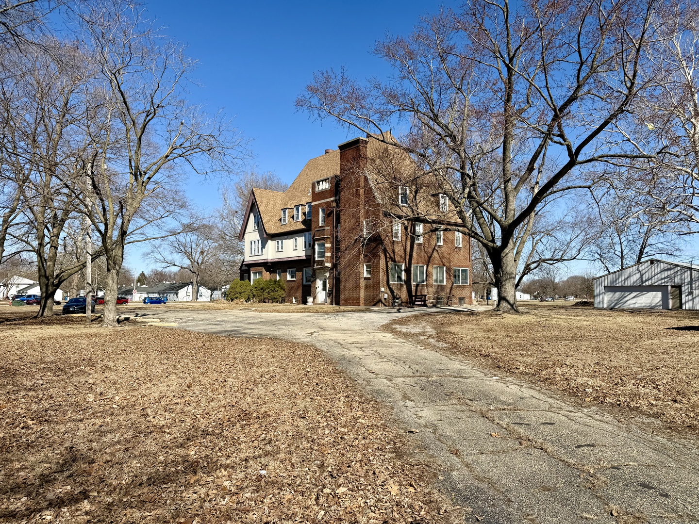 106 North Chanute Street Rantoul, IL 61866 - Photo 5 of 6 a building with trees in front of it