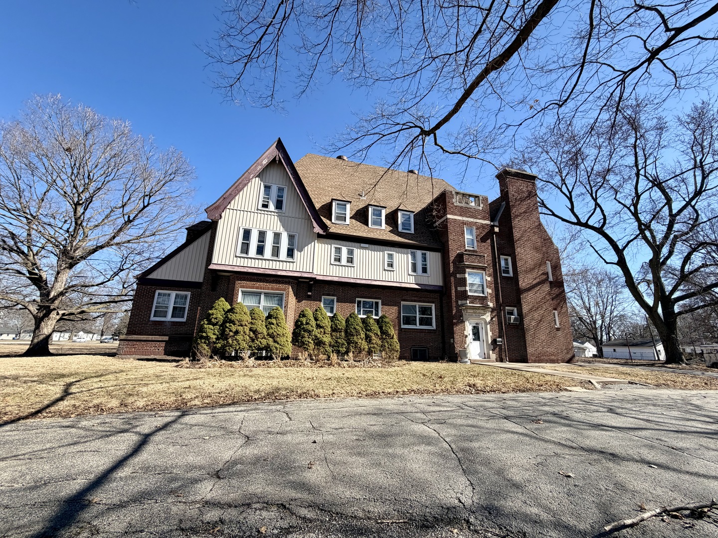 106 North Chanute Street Rantoul, IL 61866 - Photo 6 of 6 a front view of a building with large trees