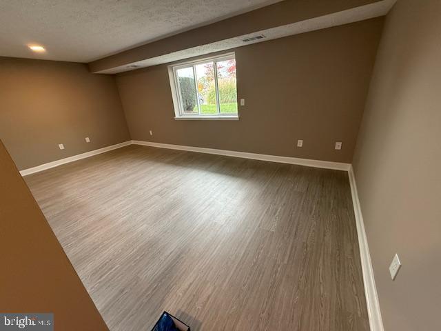 19513 Gunners Branch Road, Unit 514 Germantown, MD 20876 - Photo 14 of 42 an empty room with wooden floor and windows