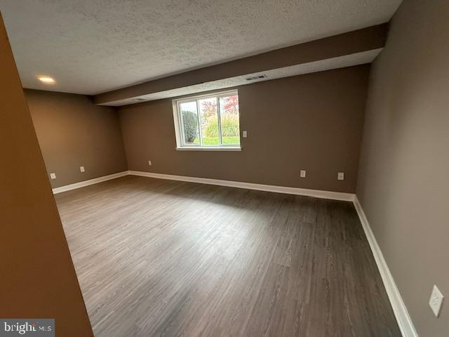 19513 Gunners Branch Road, Unit 514 Germantown, MD 20876 - Photo 16 of 42 an empty room with wooden floor and windows