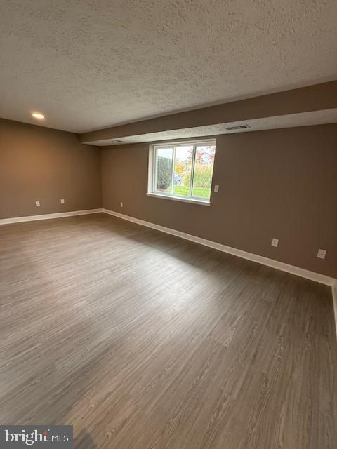 19513 Gunners Branch Road, Unit 514 Germantown, MD 20876 - Photo 20 of 42 an empty room with wooden floor and windows