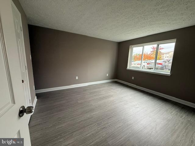 19513 Gunners Branch Road, Unit 514 Germantown, MD 20876 - Photo 21 of 42 an empty room with wooden floor and windows