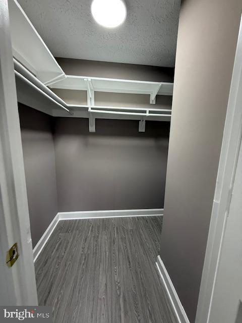 19513 Gunners Branch Road, Unit 514 Germantown, MD 20876 - Photo 22 of 42 a view of an empty room with wooden floor