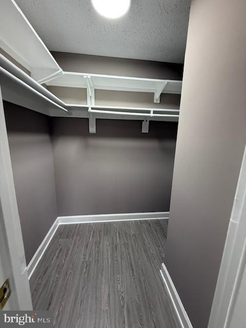 19513 Gunners Branch Road, Unit 514 Germantown, MD 20876 - Photo 24 of 42 a view of an empty room with wooden floor