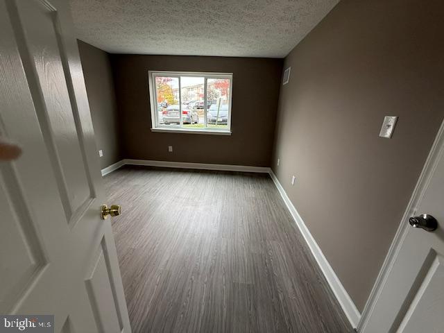 19513 Gunners Branch Road, Unit 514 Germantown, MD 20876 - Photo 29 of 42 wooden floor in an empty room with a window