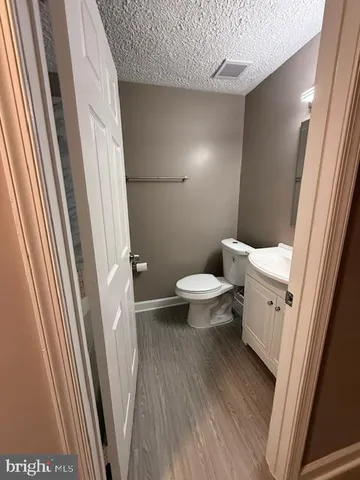 a bathroom with a sink a toilet a shower and a sink