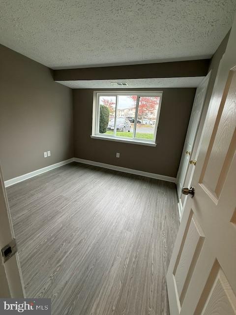 19513 Gunners Branch Road, Unit 514 Germantown, MD 20876 - Photo 37 of 42 wooden floor in an empty room with a window